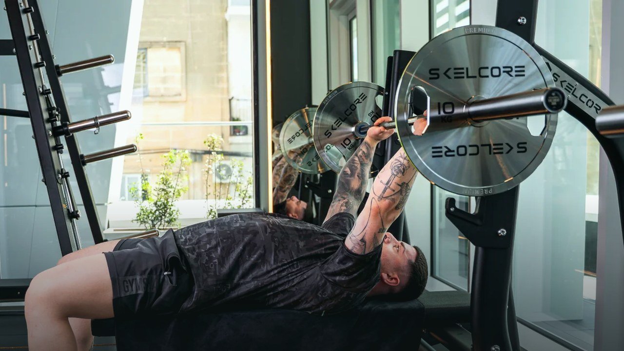 Athlete bench pressing at Prestige Recovery